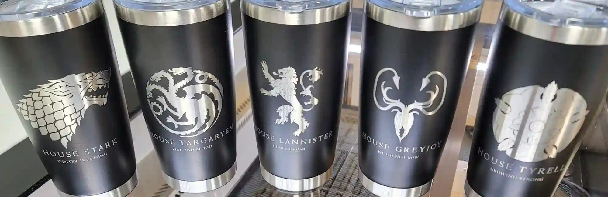 5 black stainless steel tumblers with Game of Thrones logos